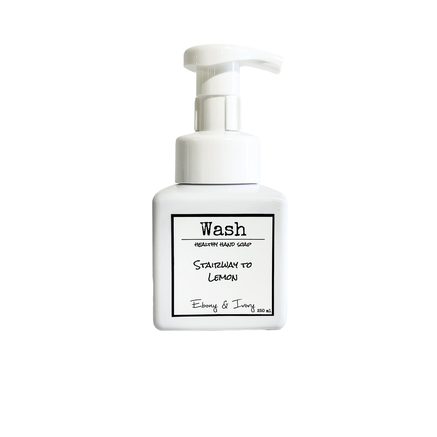 A white pump bottle of foaming hand soap with a white label named Stairway to Lemon, on a white background, made by Ebony & Ivory Candle Co in Lethbridge, Alberta, Canada