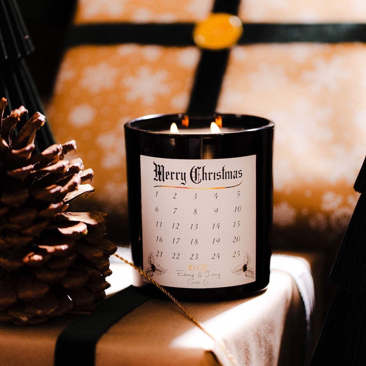 Candle with a 'Merry Christmas' label on wrapped presents with a blurred Christmas tree in the background. Advent Christmas countdown candle soy wax. #1 Christmas candle.