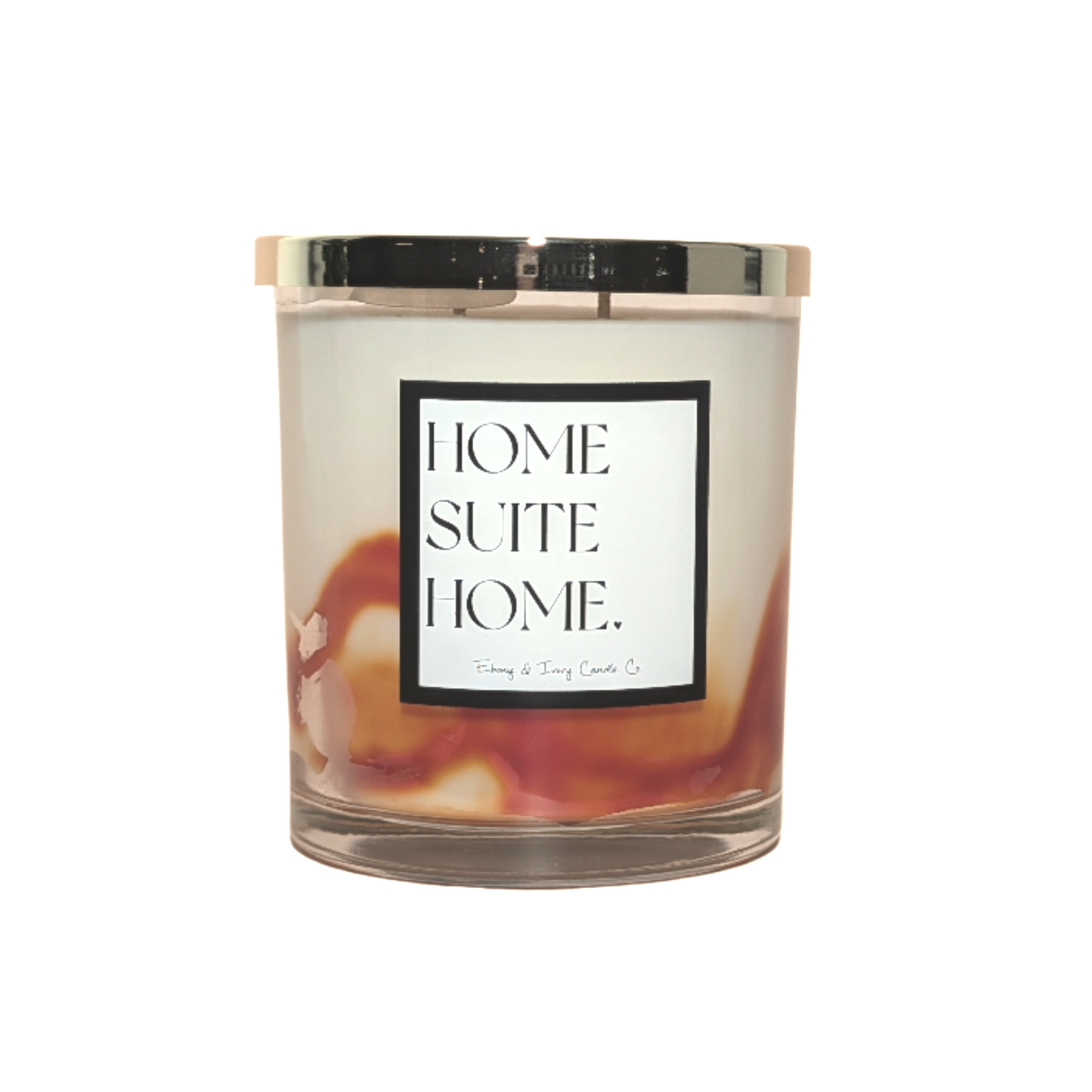 A clear glass 16oz jar soy candle with a gold lid and a white label named Home Suite Home, made by Ebony & Ivory Candle Co in Lethbridge Alberta Canada, on a white background, with ivory and orange marbled wax