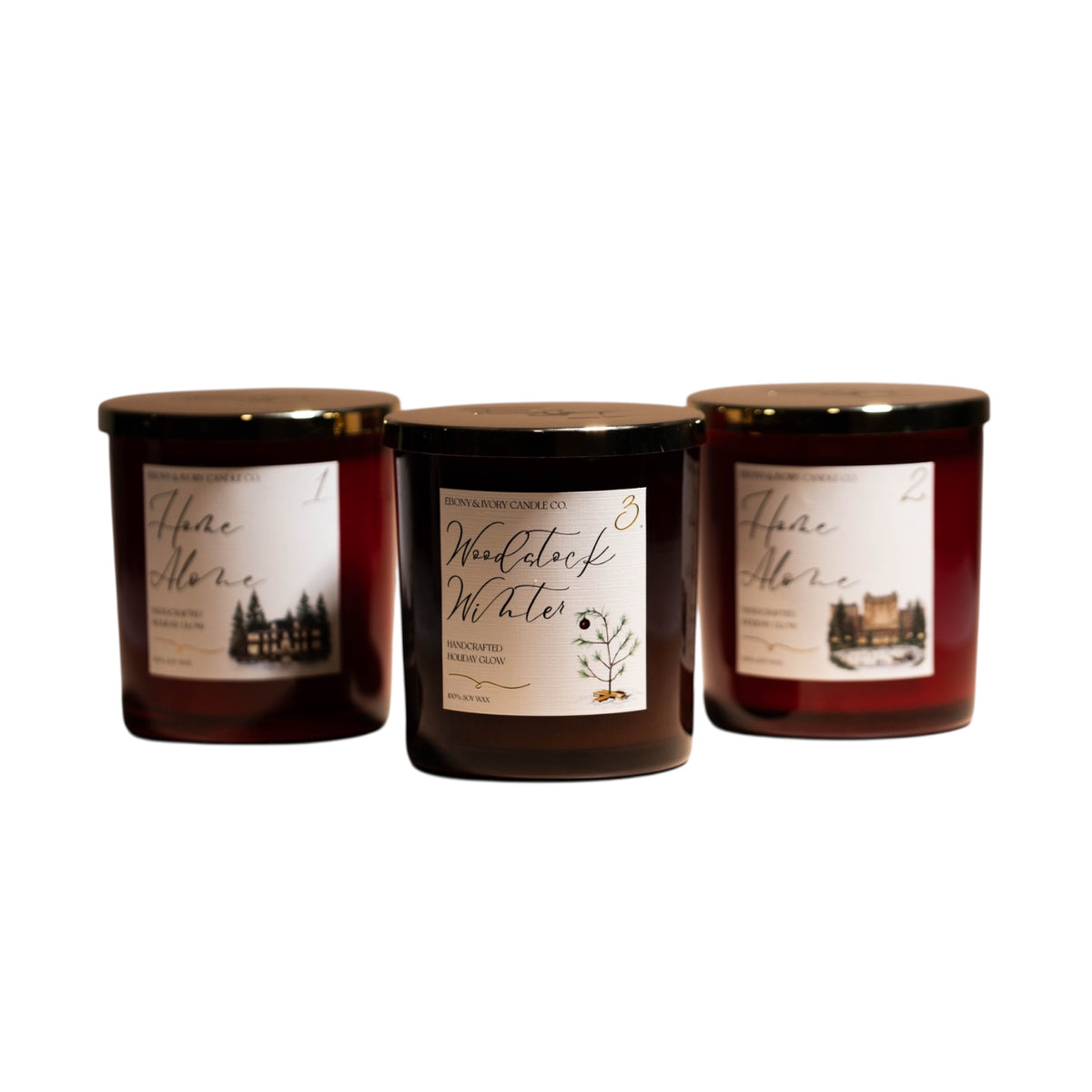 three 16oz soy christmas candles with gold lids and white labels.