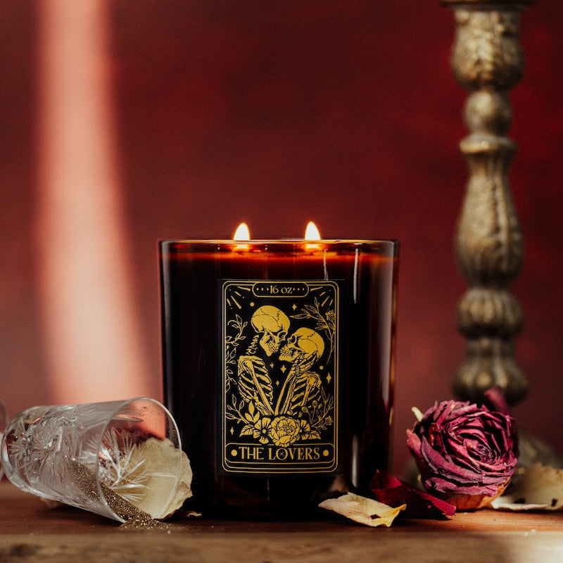 Candle labeled 'The Lovers' with decorative elements on a wooden surface. tarot lover soy candle Canada for valentines day Canada.