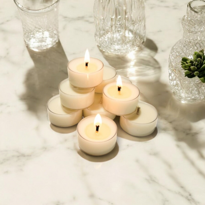 10 clear soy tea lights on a white marble counter top, made by Ebony & Ivory Candle Co in Lethbridge, Alberta, Canada