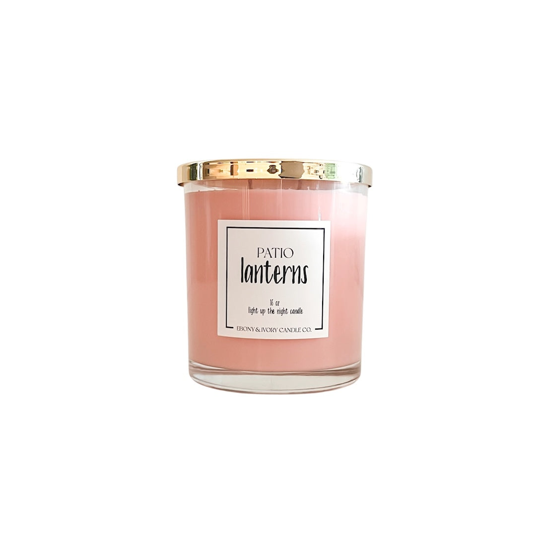 Pink candle with a gold lid and label on a white background
