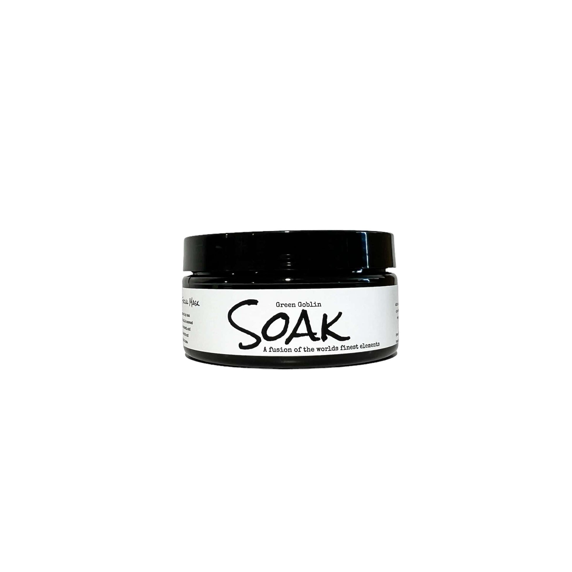 A 4oz round black jar with a white label named Green Goblin Clay Soak, on a white background, made by Ebony & Ivory Candle Co in Lethbridge, Alberta, Canada