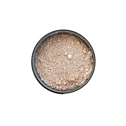 A top down shot of a round black jar with pink clay bath soak, on a white background, made by Ebony & Ivory Candle Co in Lethbridge, Alberta, Canada
