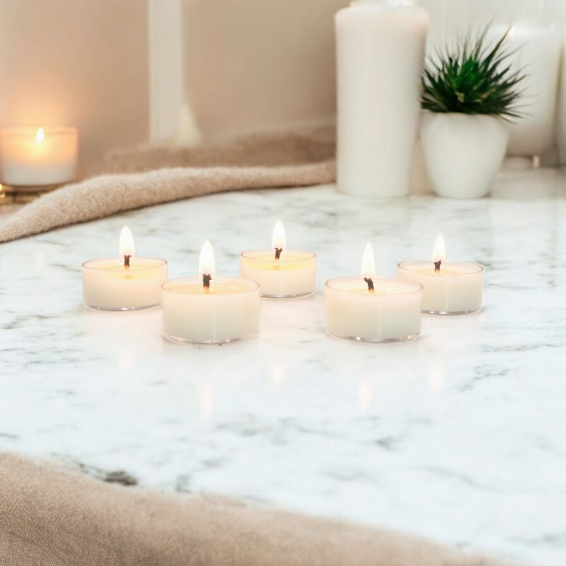 5 clear soy tea lights on a white marble counter top, made by Ebony & Ivory Candle Co in Lethbridge, Alberta, Canada