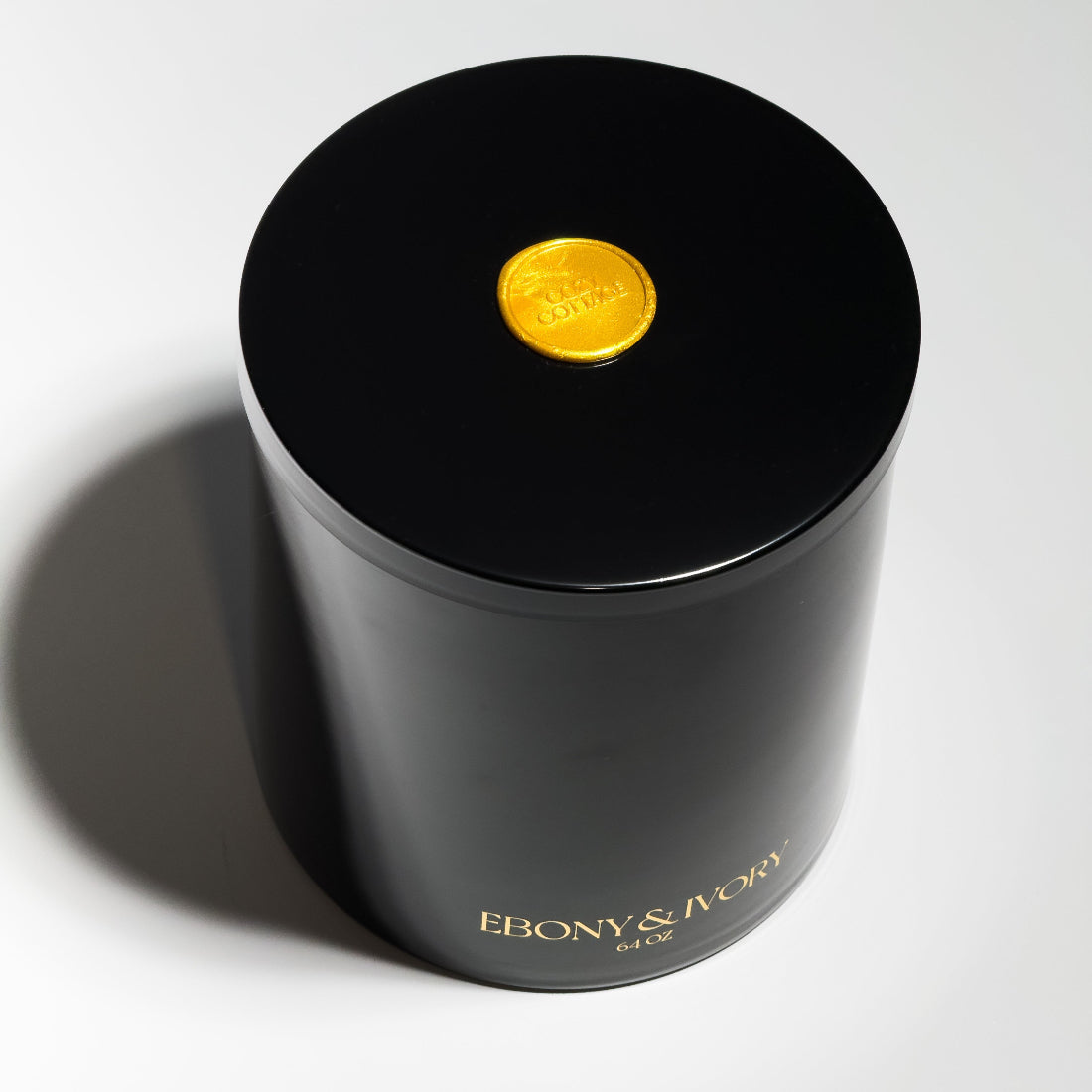 Black luxury candle jar with gold logo and gold seal. Best non toxic candle Canada, huge large statement soy candle.
