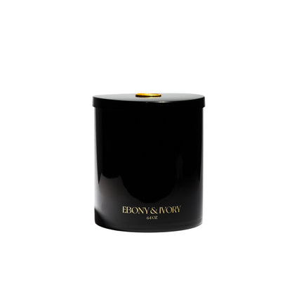 A large 64oz black jar soy candle with gold lettering and a gold wax seal on the lid, on a white background, made by Ebony & Ivory Candle Co in Lethbridge, Alberta, Canada