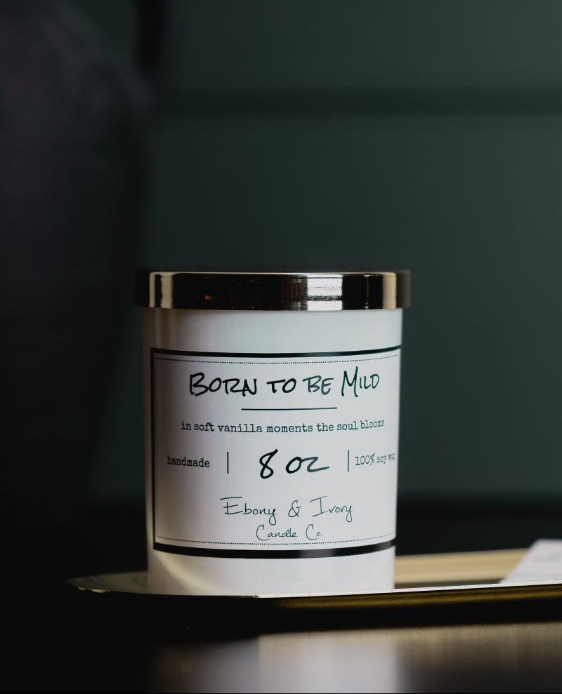 Candle with a label on a dark background