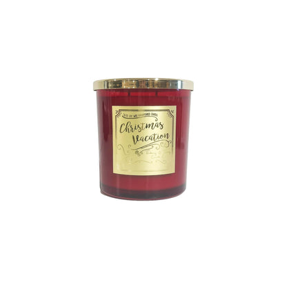 A red 16oz soy christmas candle with a gold lid and a gold label named "christmas vacation"