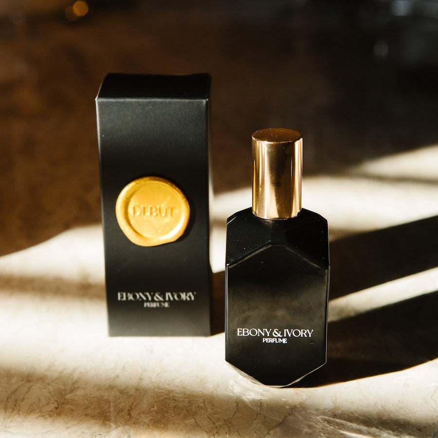 long lasting perfume for women jasmine cherry scent. black perfume bottle with black box and gold seal.
