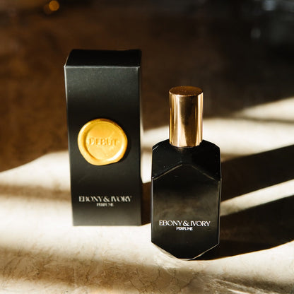 long lasting perfume for women jasmine cherry scent. black perfume bottle with black box and gold seal.
