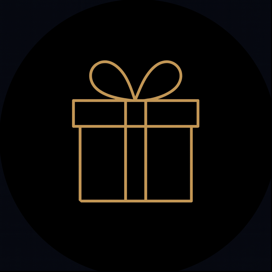 Gold outline of a gift box with a bow on a black background for the mystery gifts given by Ebony & Ivory Candle Co in Lethbridge, Alberta, Canada