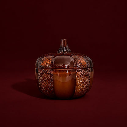 An 8oz soy wood wick soy candle in an amber heirloom pumpkin jar.