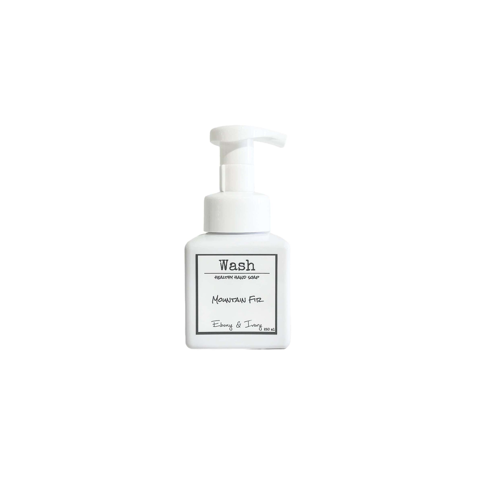 A white pump bottle of foaming hand soap with a white label named Mountain Fir, on a white background, made by Ebony & Ivory Candle Co in Lethbridge, Alberta, Canada