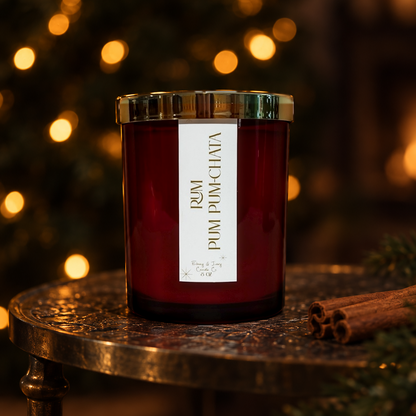 red jar with gold lid candle that is made from soy wax and smells like rumchata