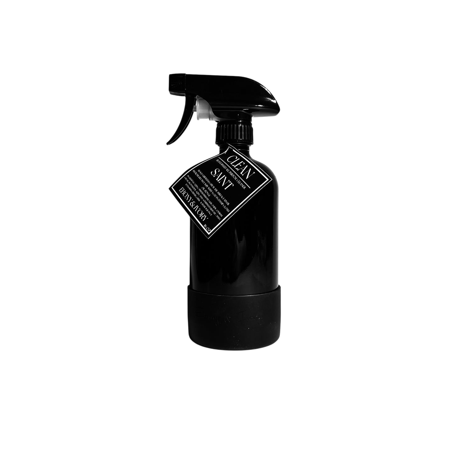 A 16oz black sprayer bottle of all purpose cleaner with a rubber bottom and a black label that reads "Saint" on a white background, made by Ebony & Ivory Candle Co in Lethbridge, Alberta, Canada