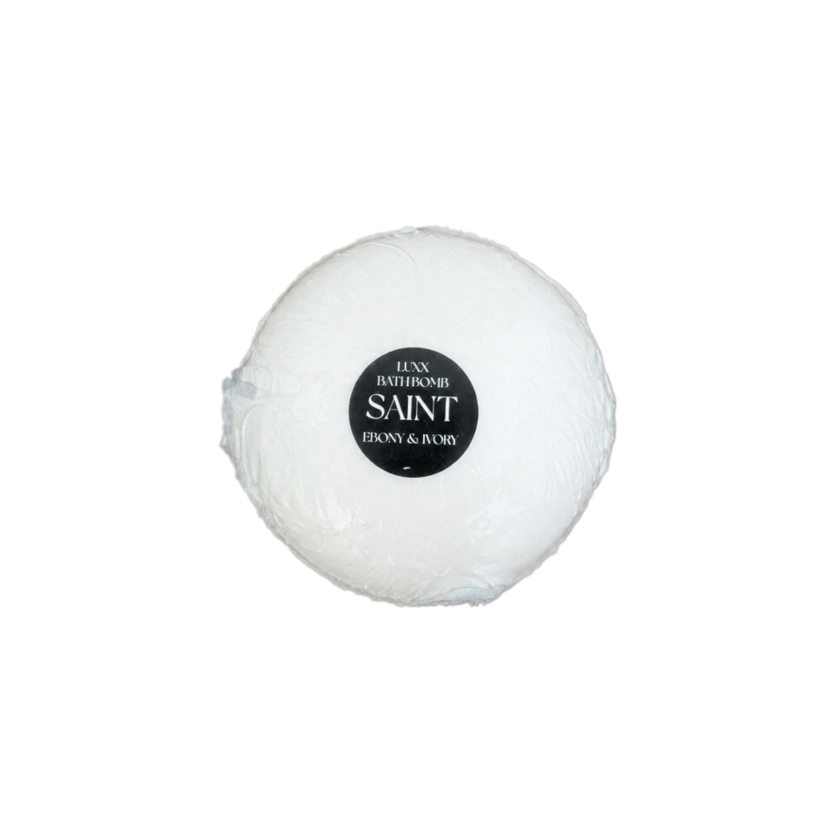 A white luxury bath bomb with a black label named "saint"