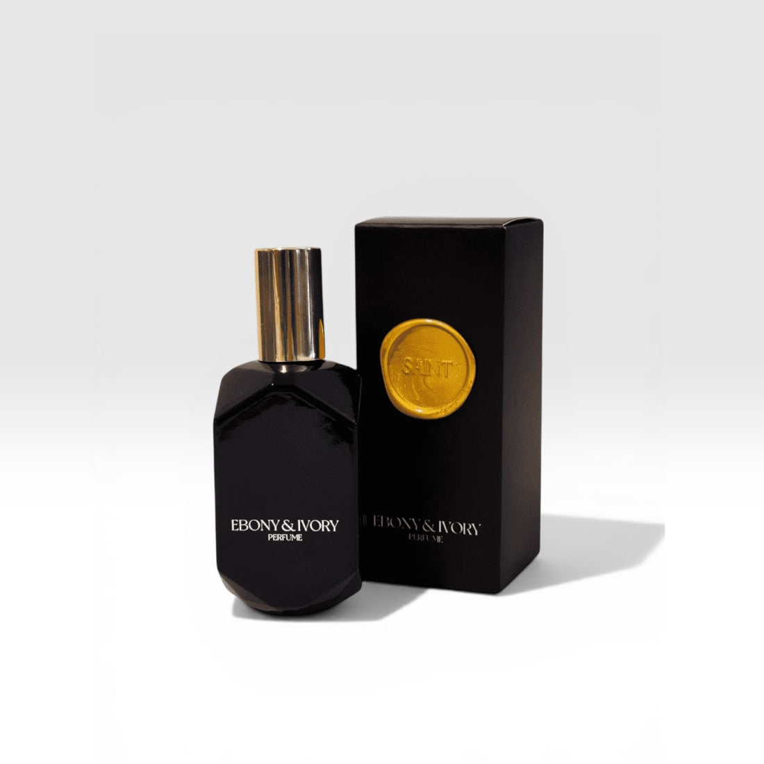 Saint Eau de Parfum by Ebony & Ivory — warm gourmand cognac vanilla fragrance in a black glass bottle