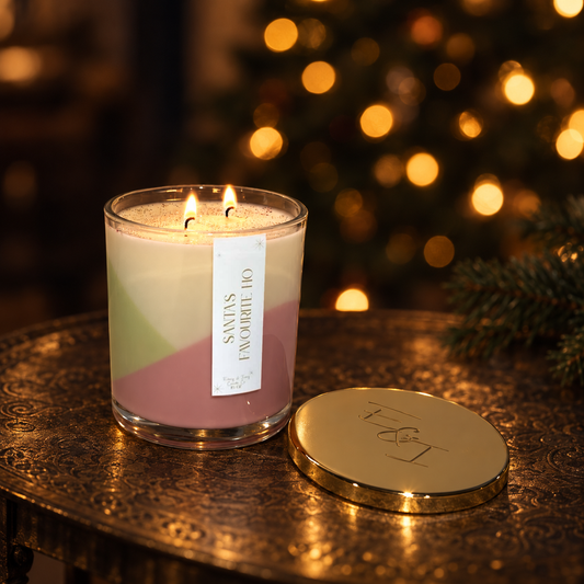 soy coconut christmas candle called Santas favourite ho in a clear jar with coloured wax and gold lid