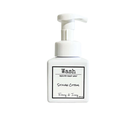 A white pump bottle of foaming hand soap with a white label named Sicilian Citrus, on a white background, made by Ebony & Ivory Candle Co in Lethbridge, Alberta, Canada
