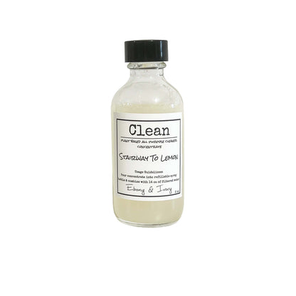 A 2oz clear bottle of all purpose cleaner concentrate with a black cap and white label that reads "Stairway to Lemon" on a white background, made by Ebony & Ivory Candle Co in Lethbridge, Alberta, Canada