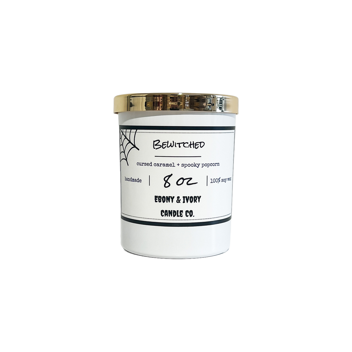A white 8oz soy candle with a gold lid and a white label named "bewitched"