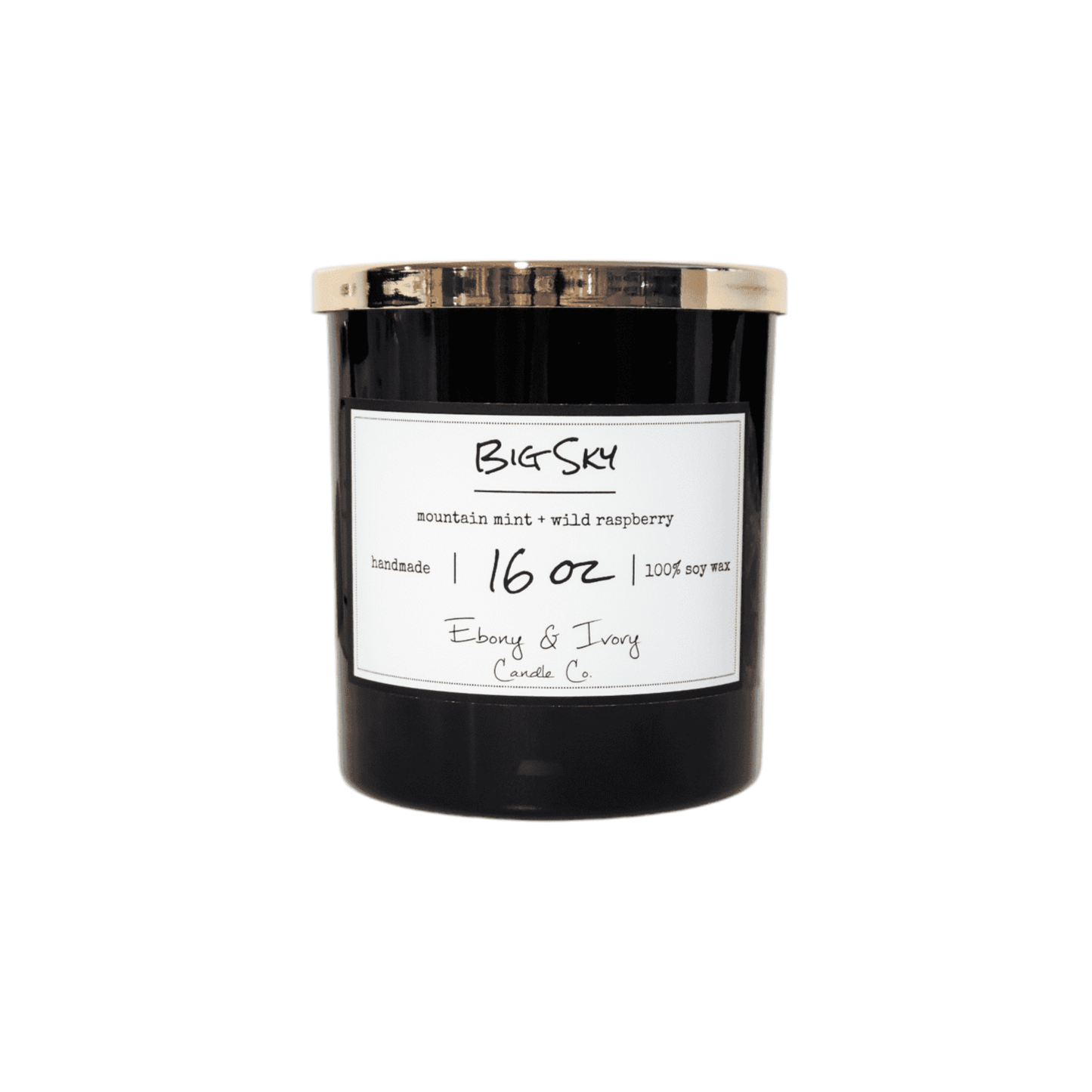 A black 16oz jar soy candle with a gold lid and a white label named Berried in the Pines, on a white background, made by Ebony & Ivory Candle Co in Lethbridge, Alberta, Canada