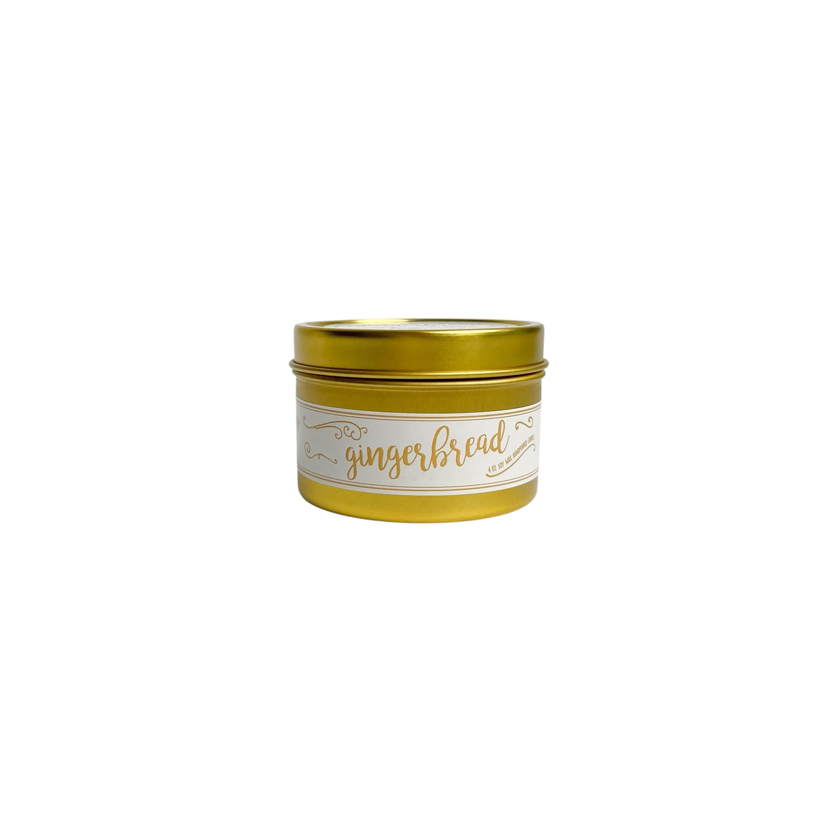 A gold 4oz soy christmas candle with a white and gold label named "gingerbread"