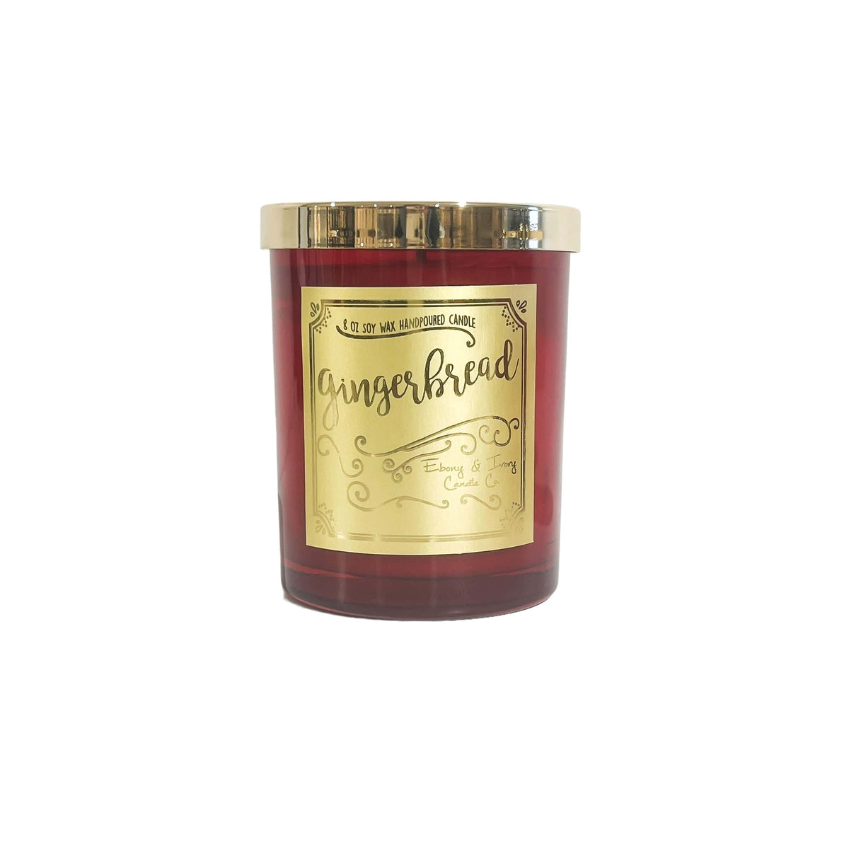 A red 8oz soy christmas candle with a gold lid and a gold label named "gingerbread"
