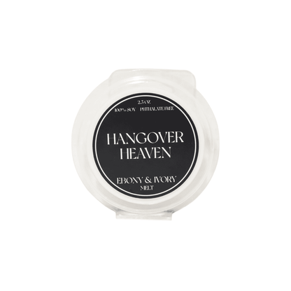 A clear clamshell wax melt tart with a black label named Hangover Heaven, on a white background, made by Ebony & Ivory Candle Co in Lethbridge, Alberta, Canada