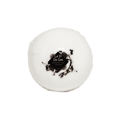 A white bath bomb with hibiscus petals on top and a round sticker label named La Di Da Spa, on a white background, made by Ebony & Ivory Candle co in Lethbridge, Alberta, Canada