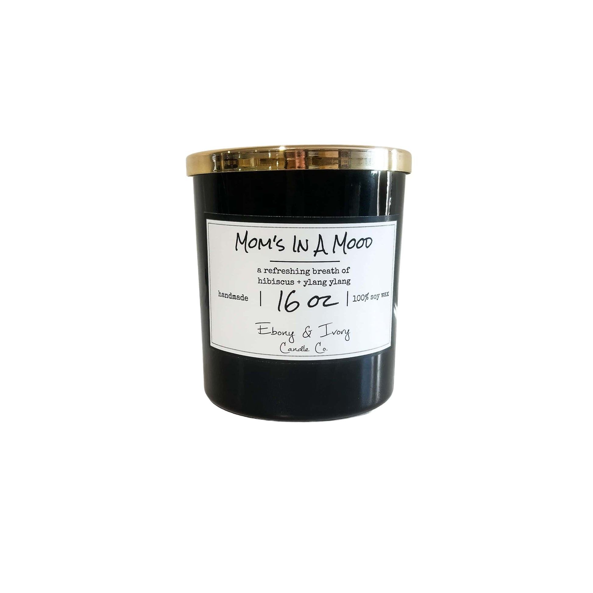 A black jar 16oz soy candle with a gold lid and a white label named Mom's in a Mood, on a white background, made by Ebony & Ivory Candle Co in Lethbridge, Alberta, Canada