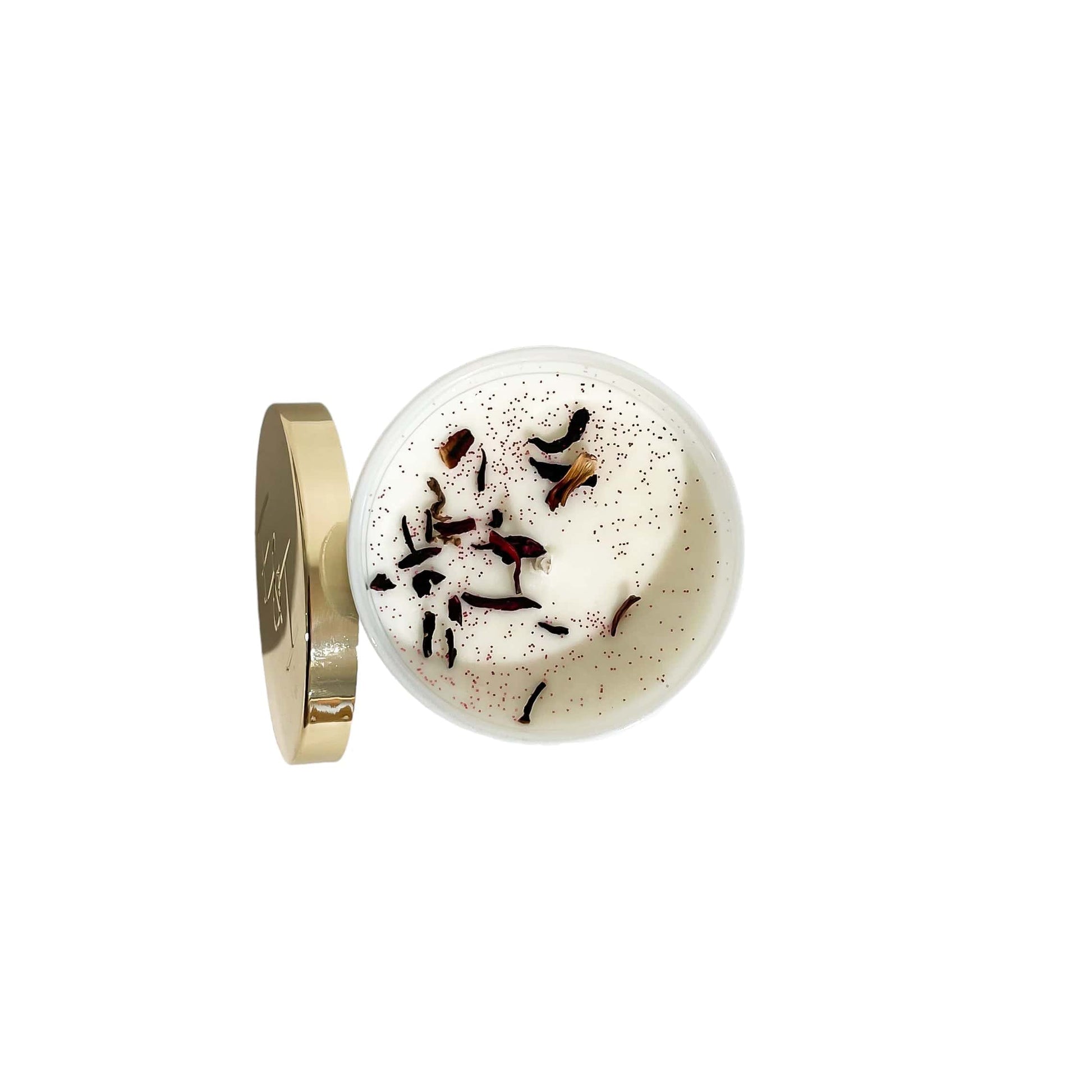 A top down view of a white jar 8oz soy candle with a sprinkle of hibiscus flowers and pink glitter on the wax and a gold lid and a white label named Mom's in a Mood, on a white background, made by Ebony & Ivory Candle Co in Lethbridge, Alberta, Canada