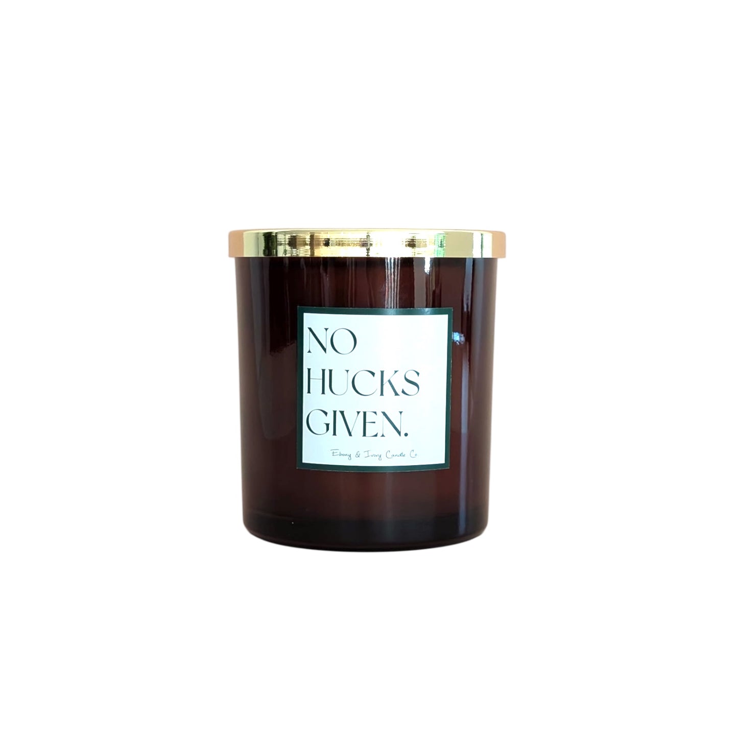 An amber jar 16oz soy candle with a gold lid and a white label named No Hucks Given, on a white background, made by Ebony & Ivory Candle Co in Lethbridge, Alberta, Canada