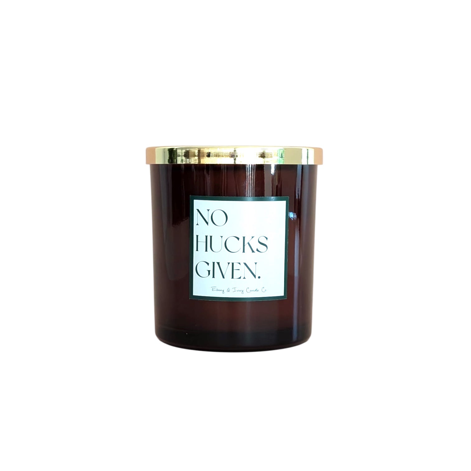 An amber jar 16oz soy candle with a gold lid and a white label named No Hucks Given, on a white background, made by Ebony & Ivory Candle Co in Lethbridge, Alberta, Canada