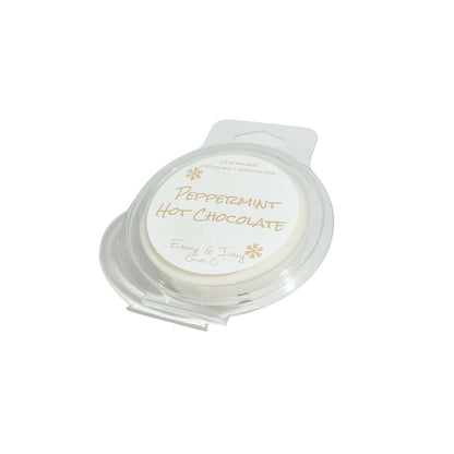 a clear clamshell wax melt with a white label named "peppermint hot chocolate"