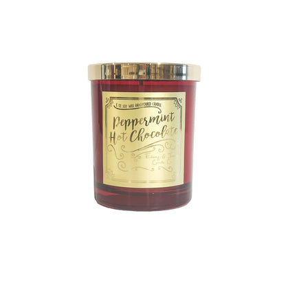 A red 8oz soy christmas candle with a gold lid and gold label named "peppermint hot chocolate"