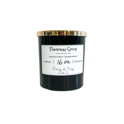 a Black 16 oz soy candle with a gold lid and white label named "pumpkin Spice" on a white background