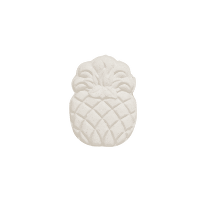 A pineapple shaped bath bomb on a white background. Made in Lethbridge, Alberta, Canada