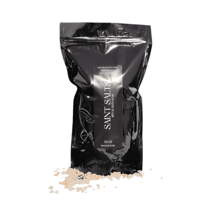 A 50oz black bag of pink Himalayan salt and epsom salt, scent with our saint phthalate free fragrance oil, with a black label named Saint Salts, made by Ebony & Ivory Candle Co in Lethbridge, Alberta, Canada 