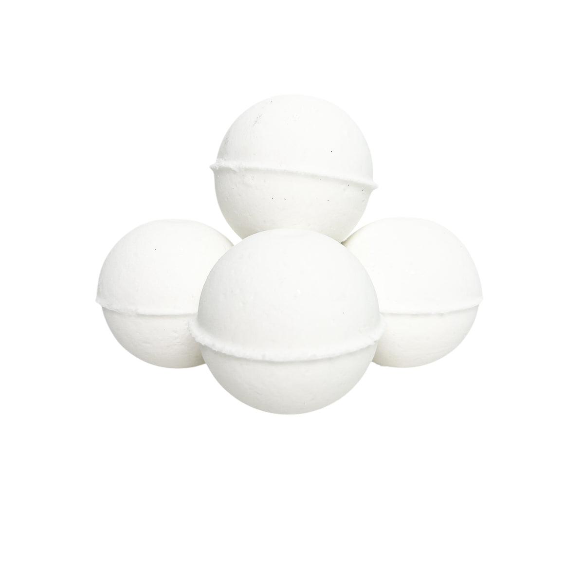 four white christmas bath bombs stacked in a small pile. 