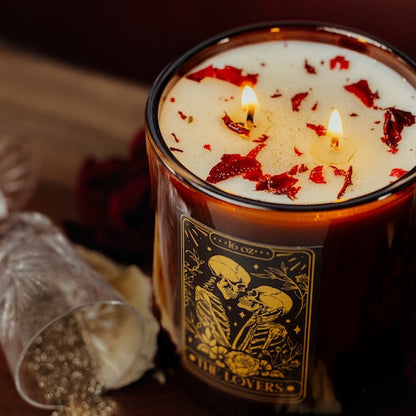 Candle labeled 'The Lovers' with decorative elements on a wooden surface. tarot lover soy candle Canada for valentines day Canada.