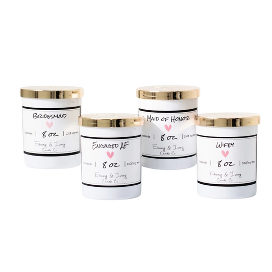 Four white 8oz jar soy candles with gold lids and white labels that read, Bridesmaid, Engaged AF, Maid of Honor, and Wifey. All on a white background, made by Ebony & Ivory Candle Co in Lethbridge, Alberta, Canada