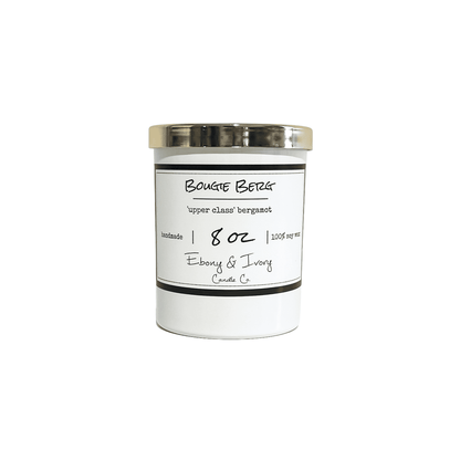 A white 8oz jar soy candle with a gold lid and a white label named Bougie Berg, on a white background, made by Ebony & Ivory Candle Co in Lethbridge, Alberta, Canada