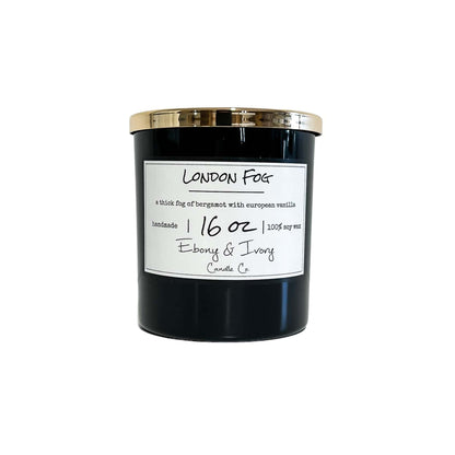 A black jar 16oz soy candle with a gold lid and a white label named London Fog, on a white background, made by Ebony & Ivory Candle Co in Lethbridge, Alberta, Canada