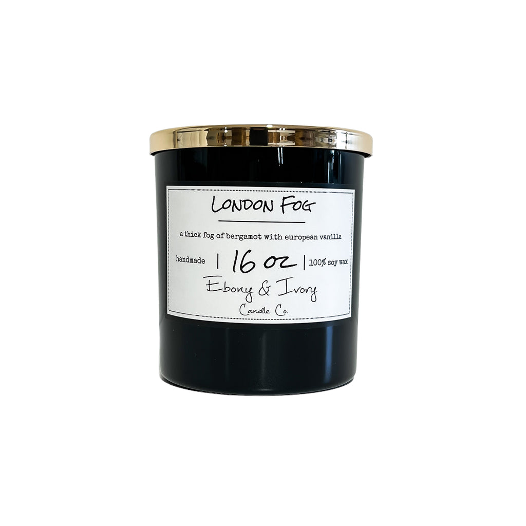 Black, sixteen ounce, bergamot and vanilla scented soy wax candle with a gold lid and a white label that reads London Fog