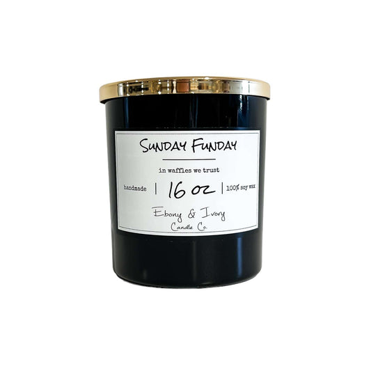 Black, sixteen ounce, sugar waffle scented soy wax candle with a white label that reads Sunday Funday