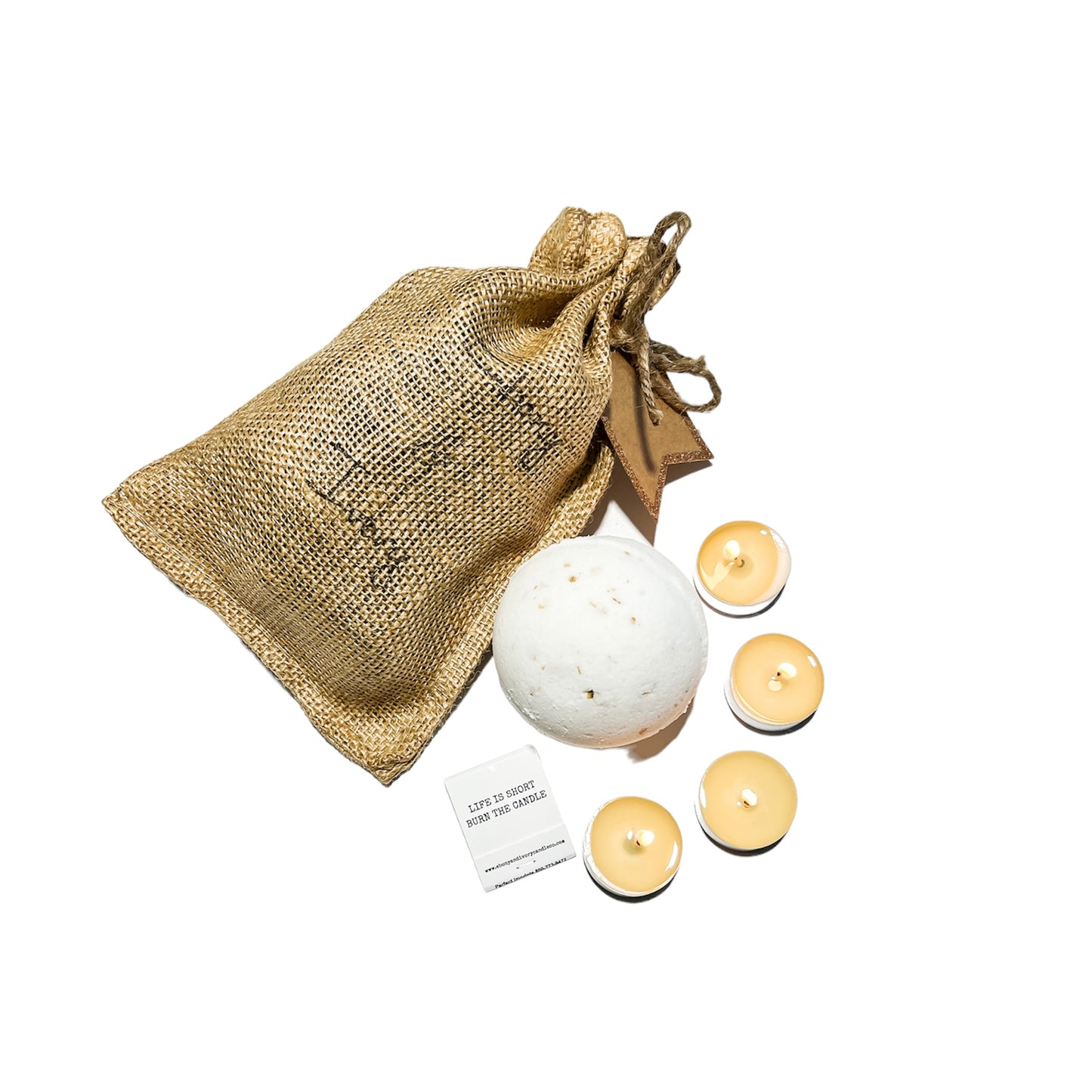 Burlap bag with an oud, bergamot, and citrus scented bath bomb and four tealights.