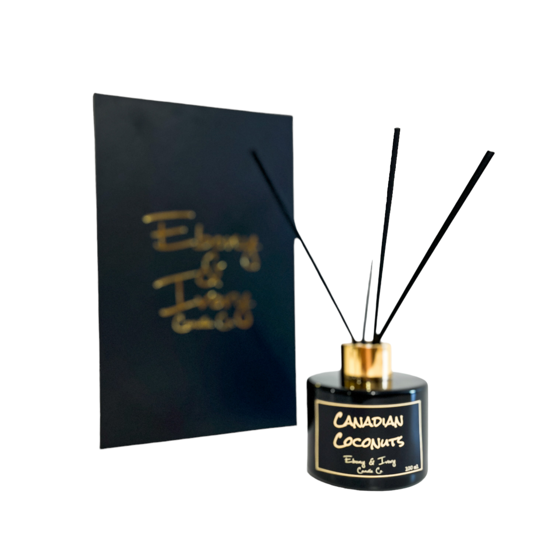 Black, one hundred milliliters, coconut, pineapple, and vanilla scented reed diffuser with a gold lid and a black label that reads Canadian Coconuts